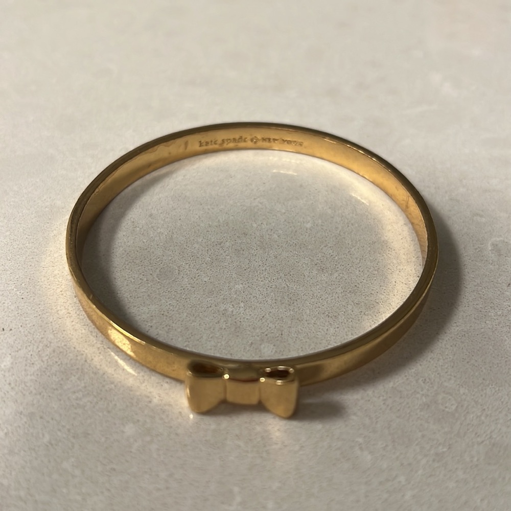 Kate Spade gold bracelet with bow detail